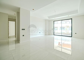 Современная квартира 2+1 в новом жилом комплексе у моря в районе Тюрклер