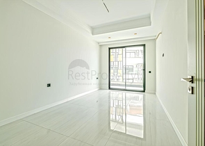 Современная квартира 2+1 в новом жилом комплексе у моря в районе Тюрклер