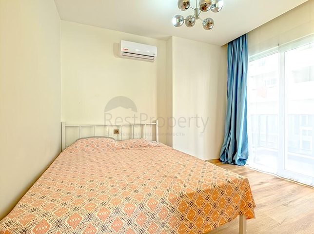 Современная квартира с просторной террасой у моря в Махмутларе