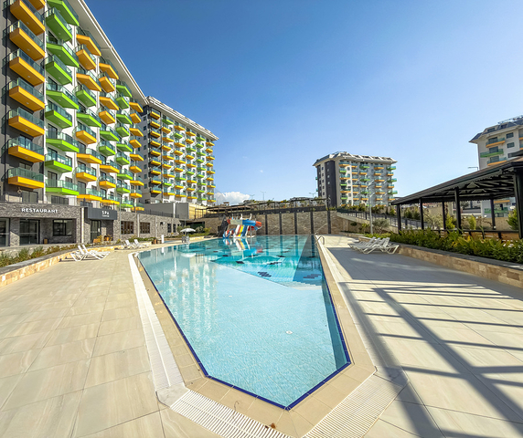 Светлая квартира 1+1 в комплексе с развитой инфраструктурой