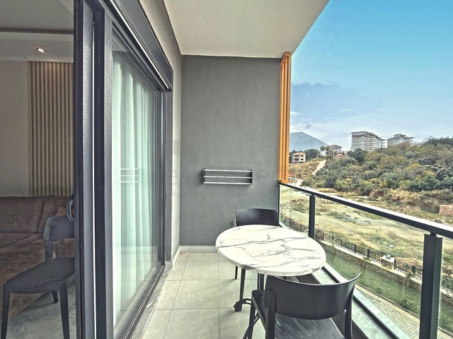 Аренда современной 1+1 квартиры в районе Оба