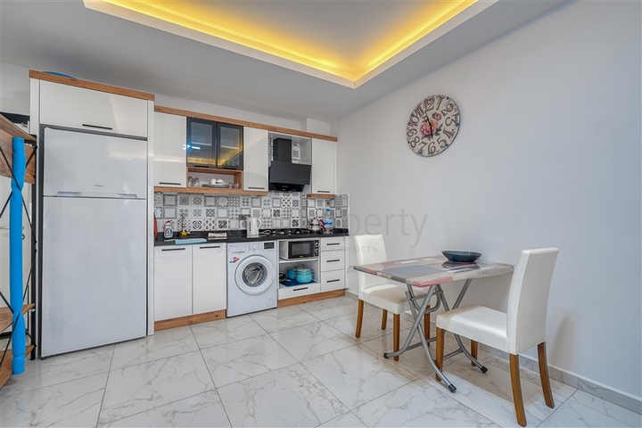 Современная меблированная квартира в новом комплексе в Махмутларе