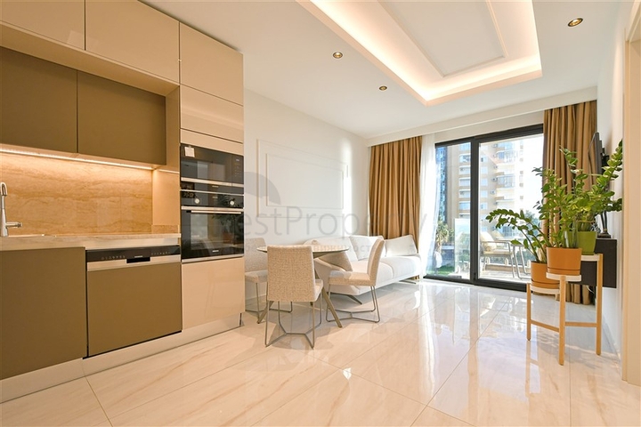 Двухкомнатная квартира с богатой инфраструктурой в районе Махмутлар