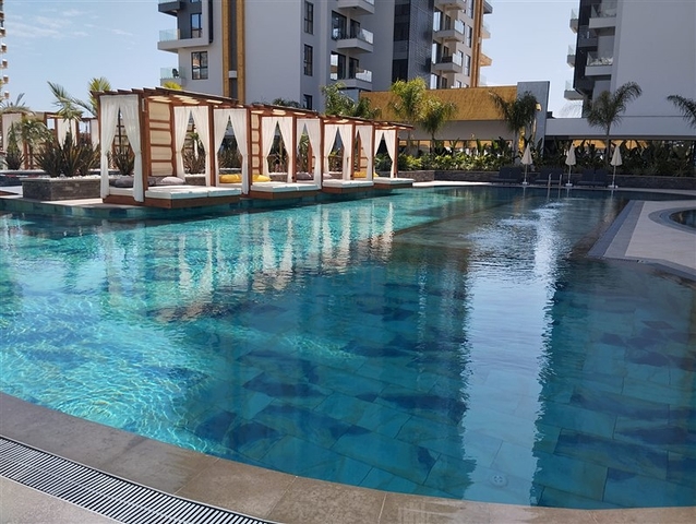 Двухкомнатная квартира с богатой инфраструктурой в районе Махмутлар