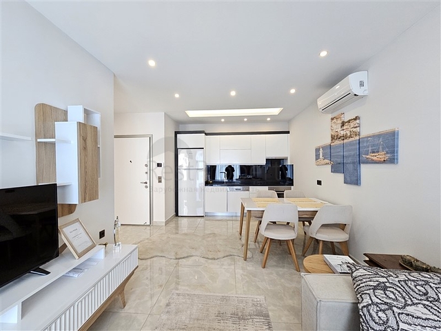 Двухкомнатная квартира 1+1 с развитой инфраструктурой в районе Махмутлар