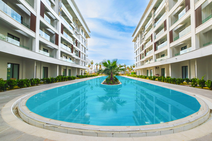 Двухкомнатный садовый дуплекс 2+1 с собственной террасой в районе Тюрклер