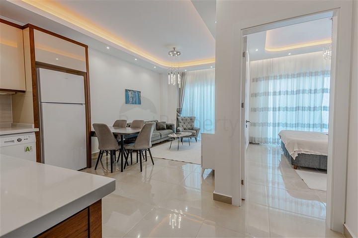 Двухкомнатная квартира 1+1 с мебелью и богатой инфраструктурой в районе Махмутлар