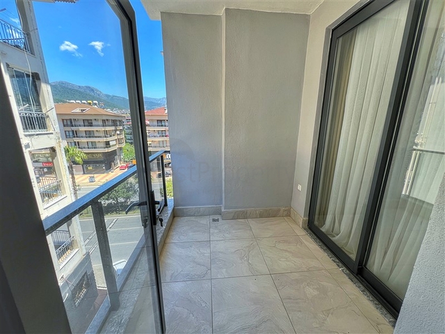 Двухкомнатная квартира 1+1 в современном доме района Оба