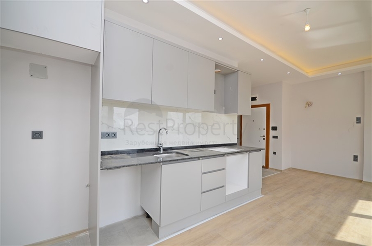 Однокомнатная квартира 1+1 в современном жилом доме района Авсаллар