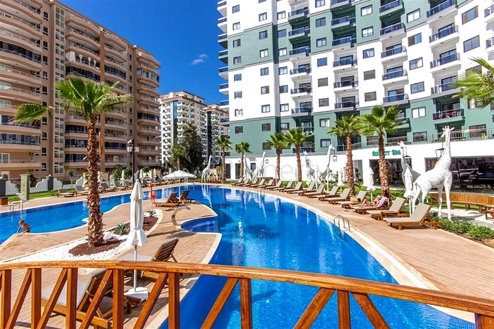 Меблированная квартира 1+1 с развитой инфраструктурой в Махмутларе