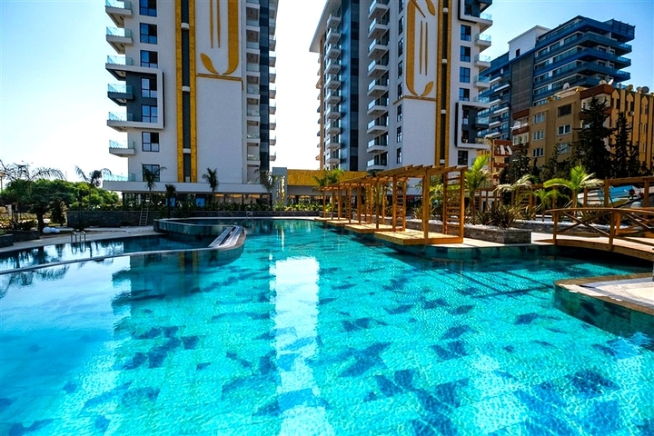 Уютная меблированная квартира в современном жилом комплексе у побережья