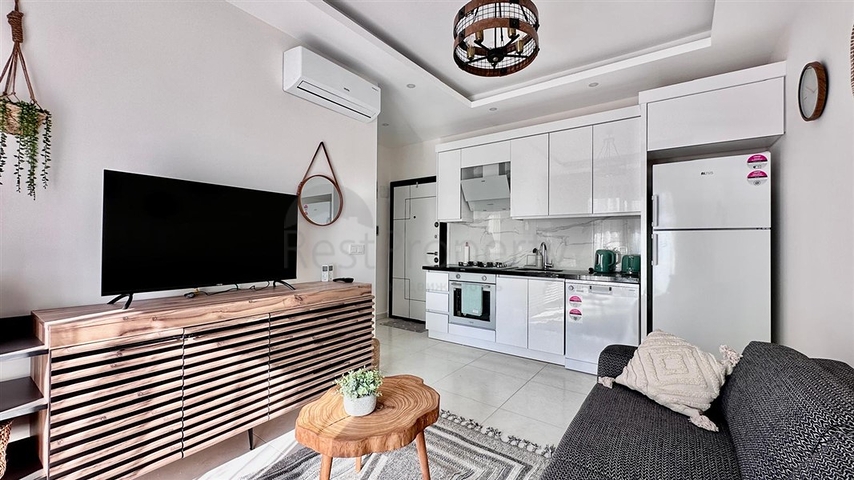 Уютная квартира 1+1 в современном доме в Махмутларе