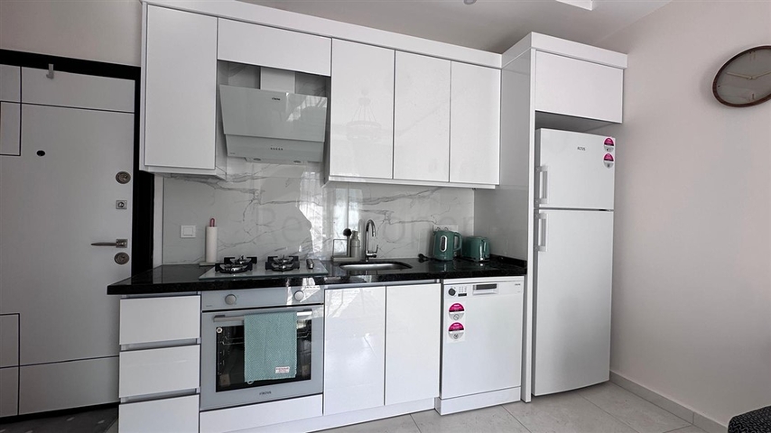 Уютная квартира 1+1 в современном доме в Махмутларе