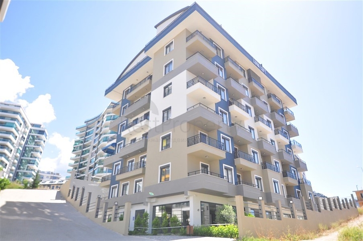 Уютная квартира 1+1 в современном доме в Махмутларе