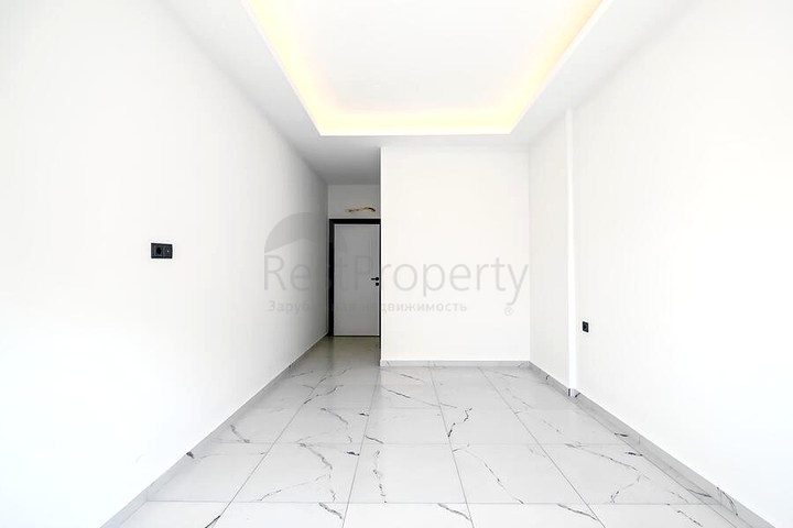 Светлая квартира 2+1 в современном жилом доме в районе Махмутлар