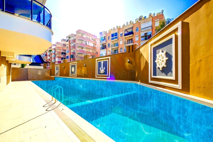 Светлая квартира 2+1 в современном жилом доме в районе Махмутлар