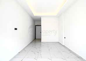 Светлая квартира 2+1 в современном жилом доме в районе Махмутлар