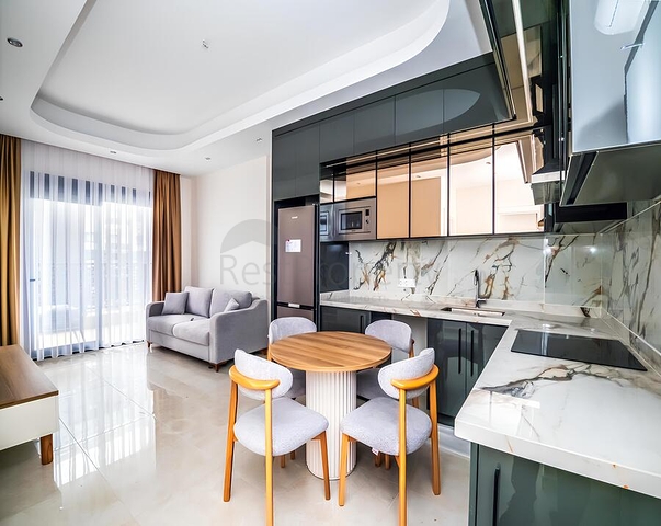 Современная меблированная квартира с развитой инфраструктурой в Махмутларе