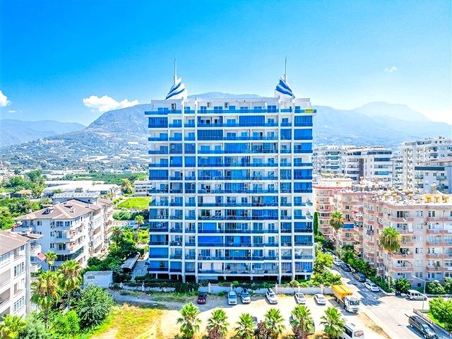 Светлая квартира 1+1 на высоком этаже в районе Махмутлар