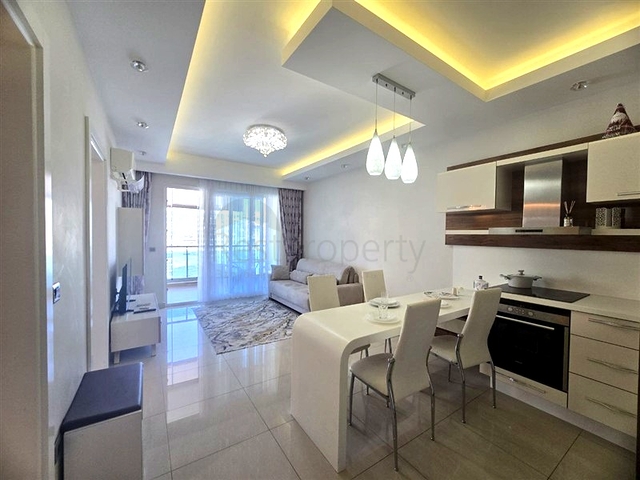 Светлая квартира 1+1 на высоком этаже в районе Махмутлар