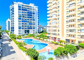 Светлая квартира 1+1 на высоком этаже в районе Махмутлар