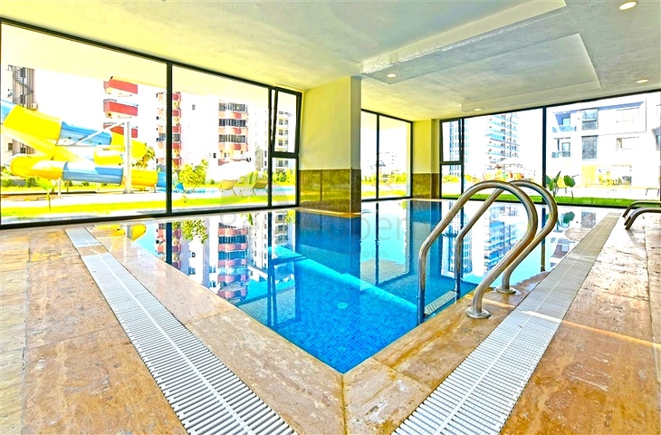 Современная квартира 1+1 с богатой инфраструктурой в районе Махмутлар