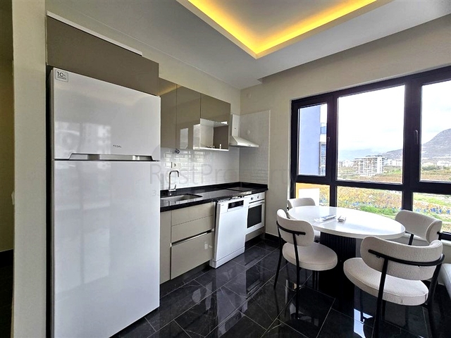 Современная квартира 1+1 с богатой инфраструктурой в районе Махмутлар