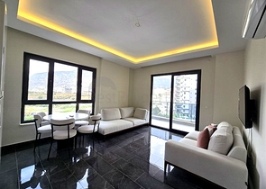 Современная квартира 1+1 с богатой инфраструктурой в районе Махмутлар