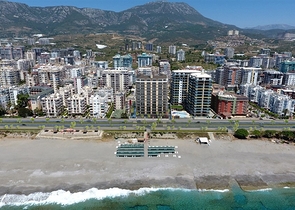 Современные квартиры в районе Махмутлар на первой береговой линии 