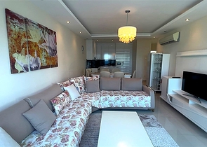 Меблированная квартира 2+1 в районе Тосмур в 50 метрах от моря 